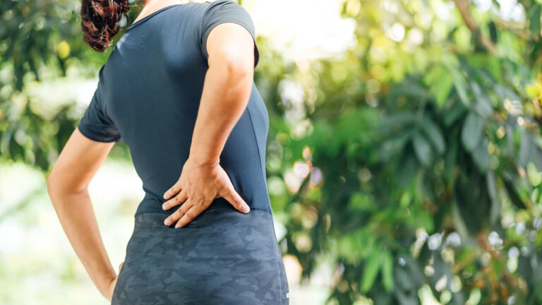 Young Asian women with back pain
