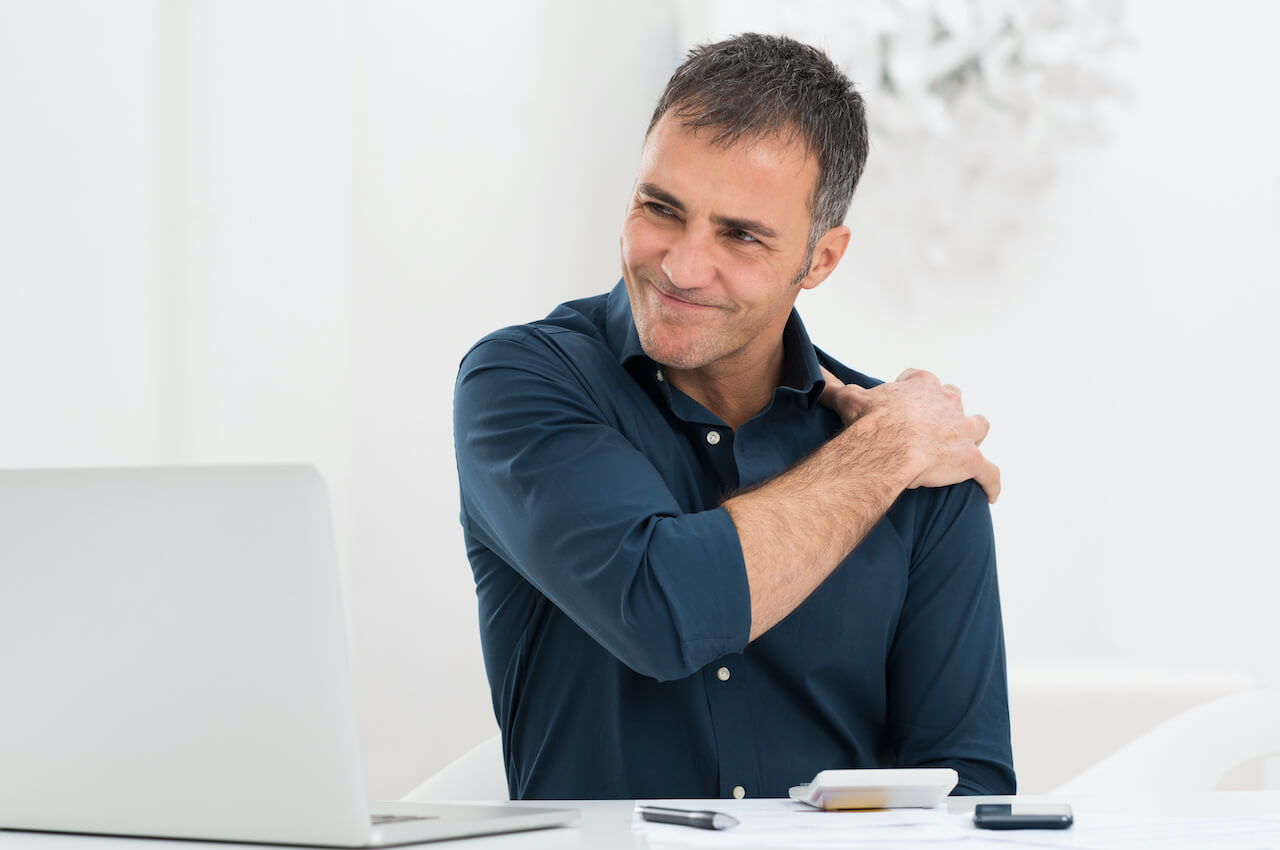 Businessman Suffering From Shoulder Pain