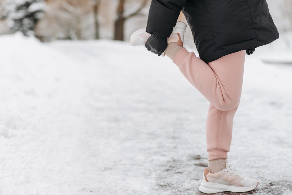 Photograph of a Person Stretching Knees